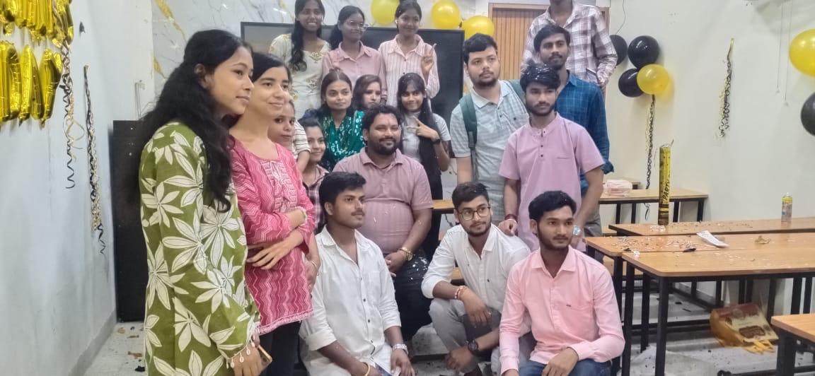 Students celebrating with Pankaj Sir in classroom at The Pankaj English Classes Dhanbad